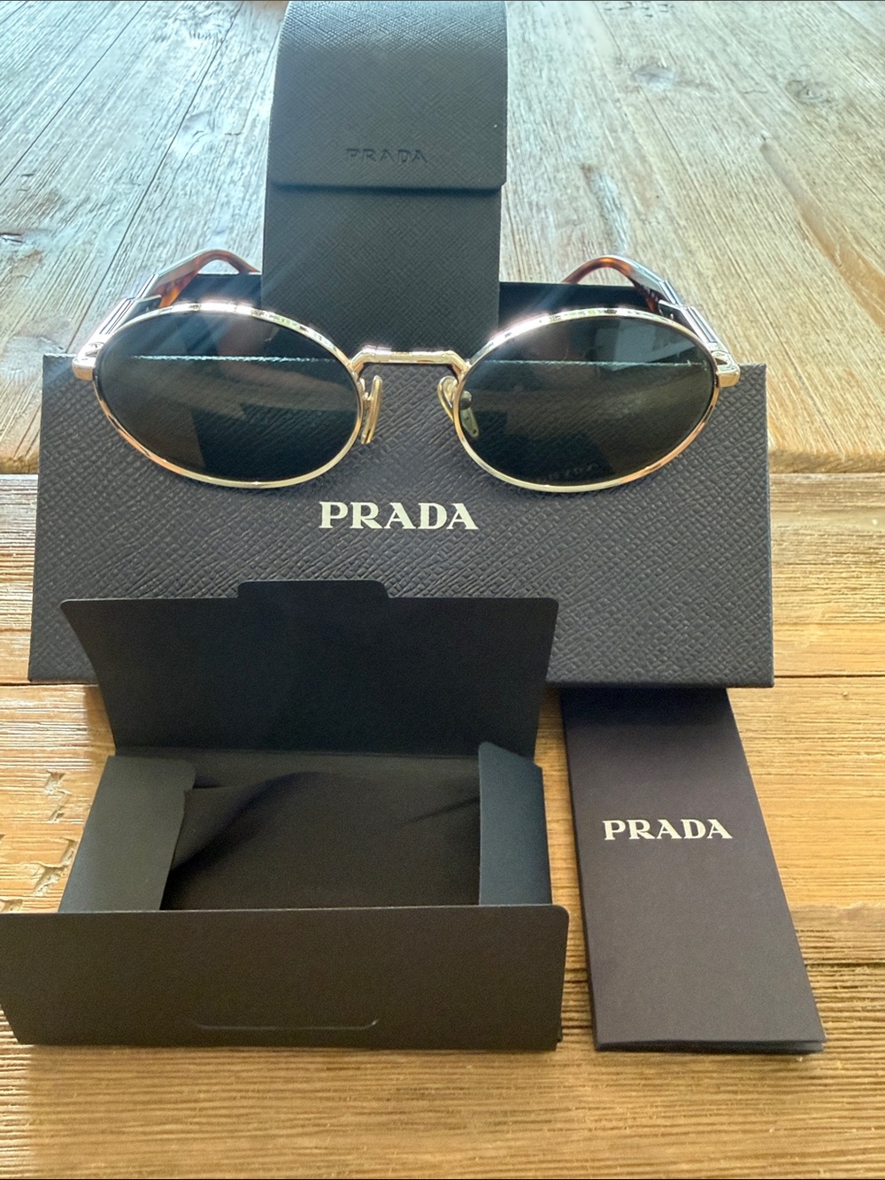 Prada Gold Frame Oval Sunglasses (PR65ZS)